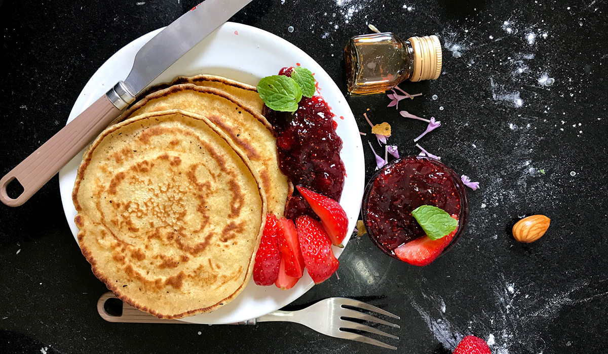 Pancake with strawberries and jam